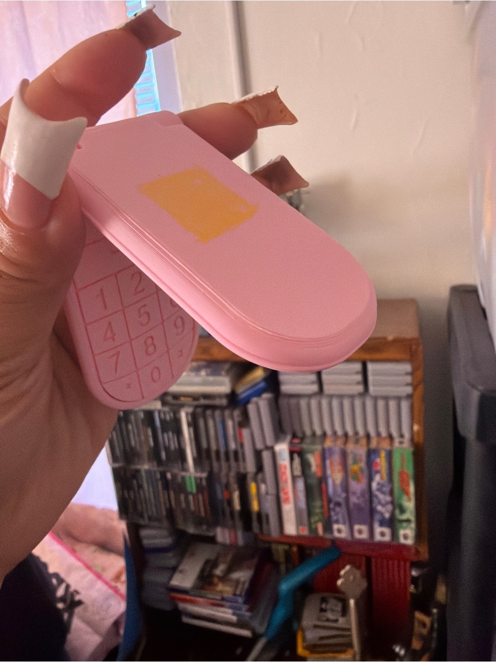 Pink Y2K toy flip phone